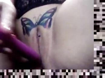 Pussy with a butterfly tattoo gets dildoed deep