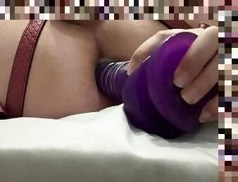 Anal stretching with large purple dildo
