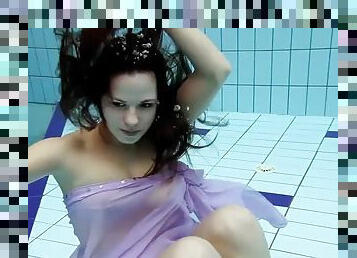 Aneta with big boobs and purple dress in the pool