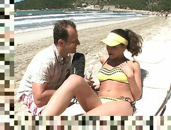 Brunette MILF Henessy fucks an anchorman on the beach