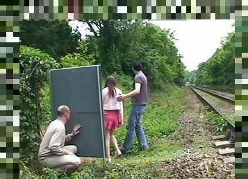 A guy jerks off while watching a couple fucking outdoors