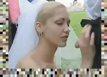 Bride sucks cock in a field on wedding day