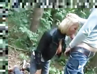 Deutsch blonde sucking and fucking a giant pecker in the woods