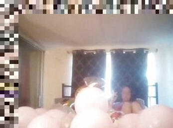 Milf with extreme long hair popping balloons and smoking cigarettes while filming up her own skirt