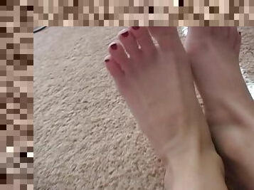 Painted red toes are sexy close up