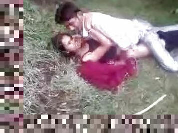 Indian couple fools around in the grass
