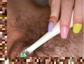 Vibrating toothbrush on clit