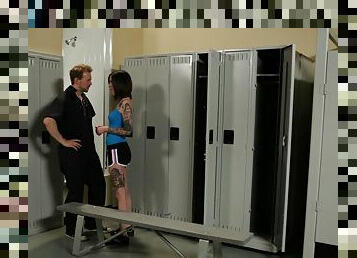 A tatted up coed gets drilled by a guy in the locker room