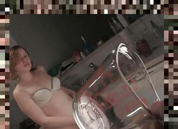 Redhead teen drinks piss after peeing on a measuring cup