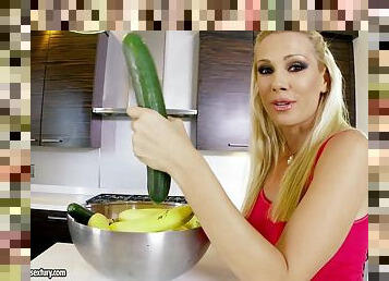 Luscious Sandy shoves a cucumber in her tight vagina