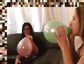 Beautiful Lady In Glasses Blowing Balloons In A Reality Shoot