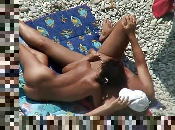 Two nude couples on the beach gets a sexy time