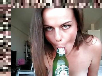 Amateur girl gives blowjob to a beer bottle