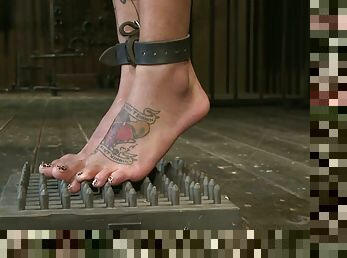 Slim and tattooed Bonnie Rotten gets chained in the stocks