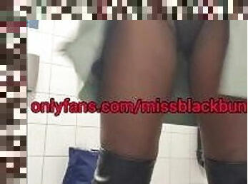 Ebony girl fucking herself in a public toalet