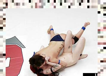 Lez inked wrestler defeats redhead loser with facesitting