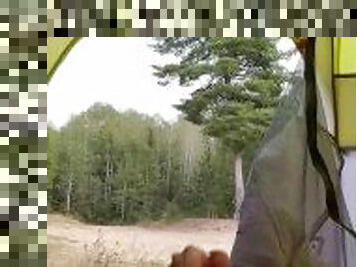 Cumming in Tent Facing Public Dirt Road