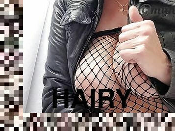 Hairy milf Munchengold with a huge pussy and huge labia does it for you in a leather jacket and fishnet suit