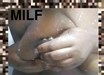 Lactating milf sucking  and drinking her sweet breast milk while showering on a shower.