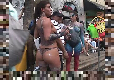 Funny amateur damsel showcasing her big tits and nice ass in a reality street party outdoor